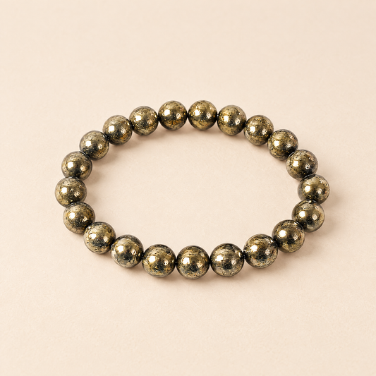 Abundance pyrite bracelet on a cream background
