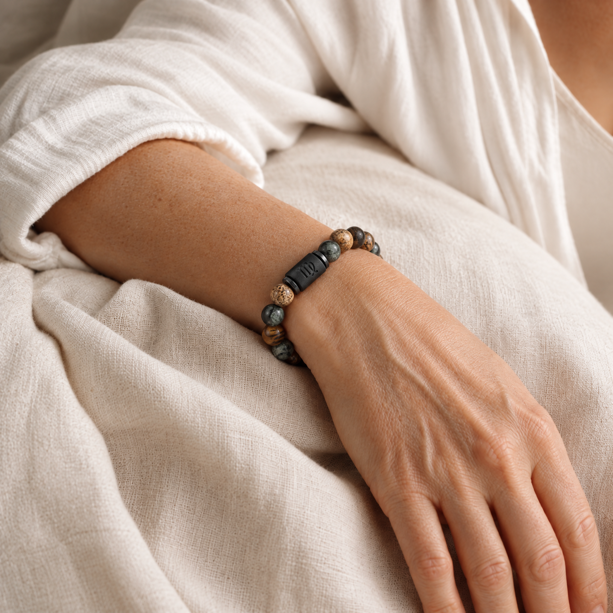 Woman wearing the zodiac bracelet in soft daylight