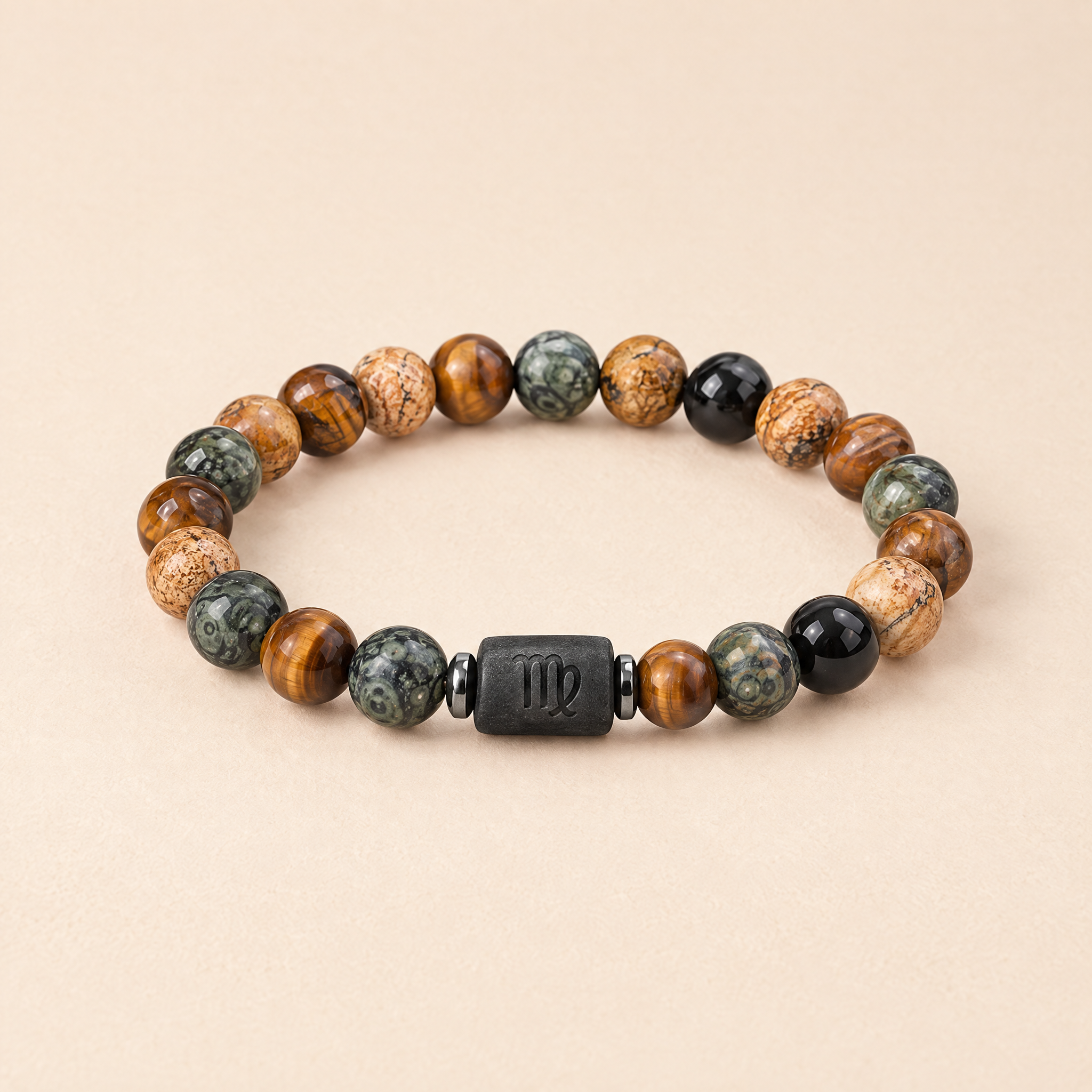 Written in the Stars zodiac bracelet on a cream background